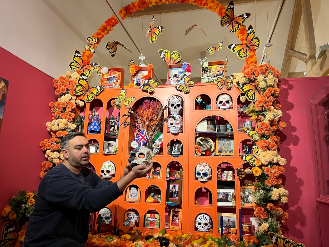 Living with Death: Adam Jaffer, Leeds Museums and Galleries' curator of world cultures, with a stunning Leeds Ofrenda, on loan from artist Ellie Harrison, recreates beautiful, traditional Mexican Day of the Dead displays.
Leeds City Museum’s Living with Death exhibition, which opens today (May 3) features a remarkable array of objects spanning thousands of years of world history and tradition which all explore how different cultures experience death, dying, and bereavement.