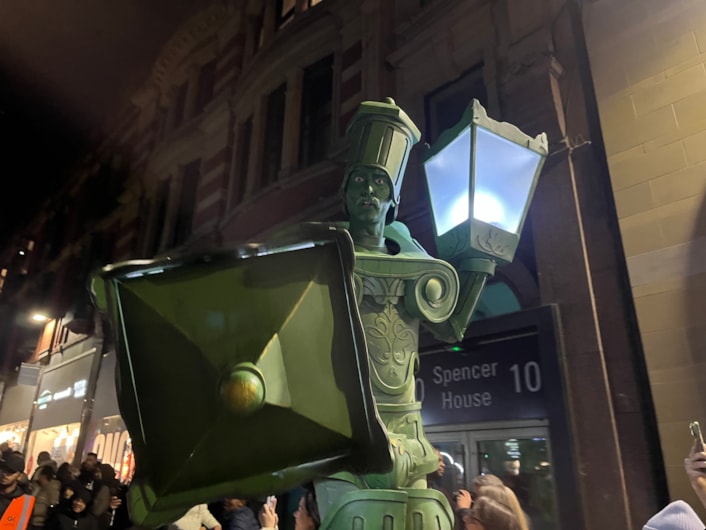 Light Night 2025: On Briggate, ten feet tall Living Lamp Posts strode among amazed onlookers.