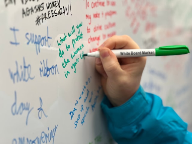Close up of signing the White Ribbon pledge wall at Birmingham New Street: Close up of signing the White Ribbon pledge wall at Birmingham New Street