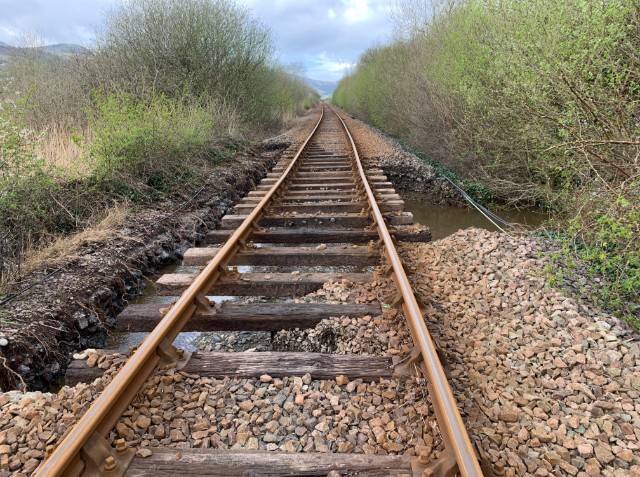 Picture from near Dolgarrog station on the Conwy Valley Line after river flooding washed away ballast on 9 April 2024: Picture from near Dolgarrog station on the Conwy Valley Line after river flooding washed away ballast on 9 April 2024