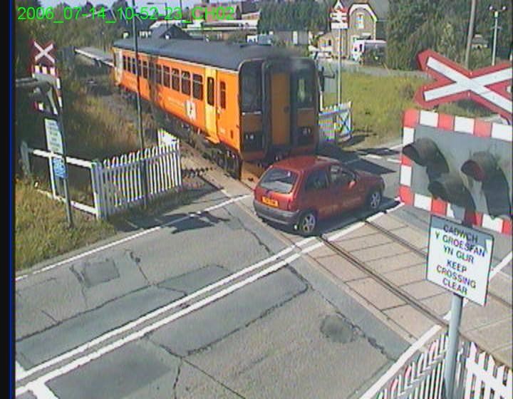 TOUGH SENTENCES NEEDED AS LEVEL CROSSING LAW BREAKING REACHES FIVE YEAR HIGH (WEST COUNTRY): Motorist narrowly avoids train smash at Llangadog LX (still image)