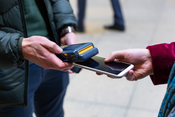 TfL’s crackdown on fare evasion sees increased ticket and payment checks and more penalty fares: TfL Image - Revenue Inspection on a phone