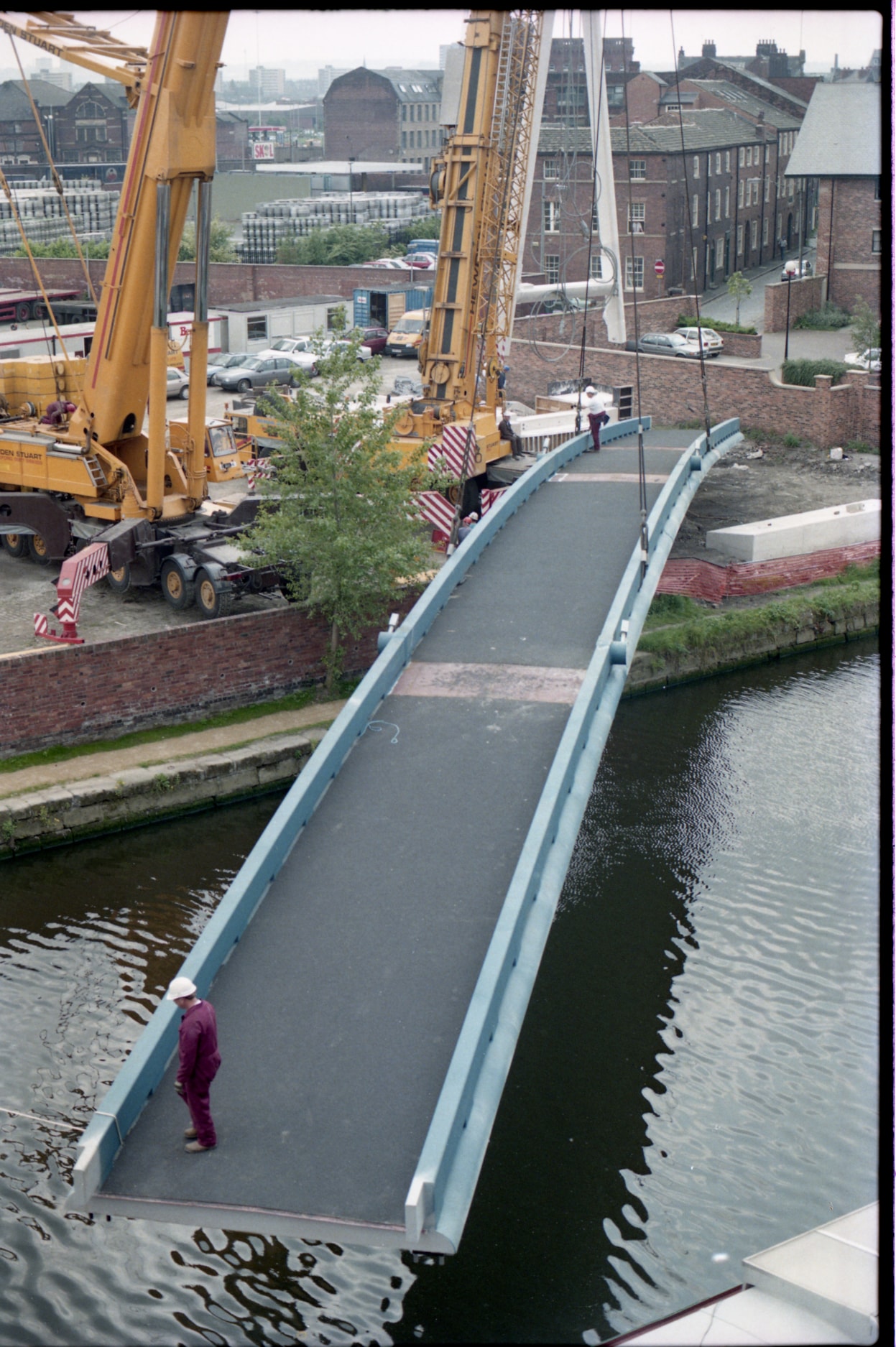 Centenary Bridge: Originally constructed in 1993, at that time the bridge was the first river crossing built in the city for more than a century, and its distinctive sweeping design has since become a much-loved riverside feature. Picture shows the bridge being winched into place during construction. Credit Yorkshire Design Group.