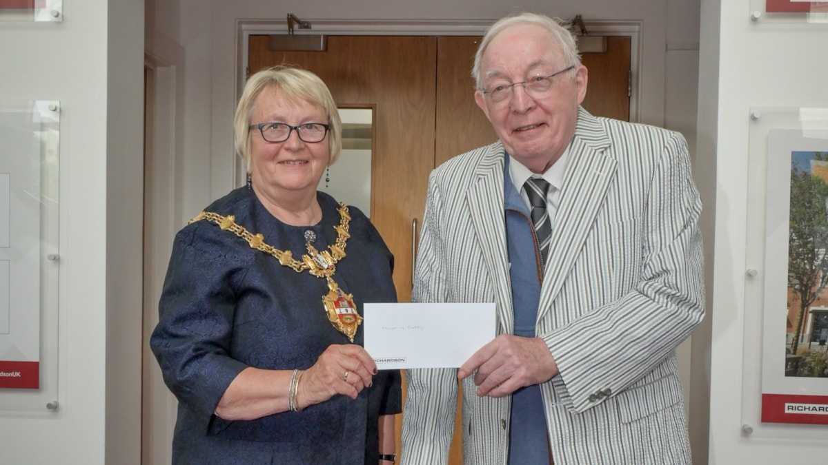 Dr Roy Richardson presents a cheque to Mayor of Dudley Councillor Hilary Bills for her charities from The Richardson Brothers Foundation