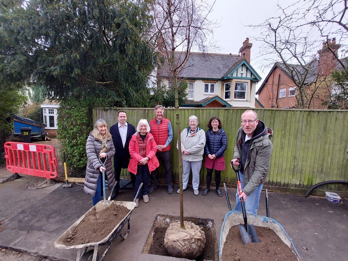 Councillors and residents plant the tree together in Kidmore Road, Caversham