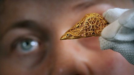 Senior Curator Dr Alice Blackwell holds the rare early medieval gold sword pommel. Photo © Stewart Attwood WEB