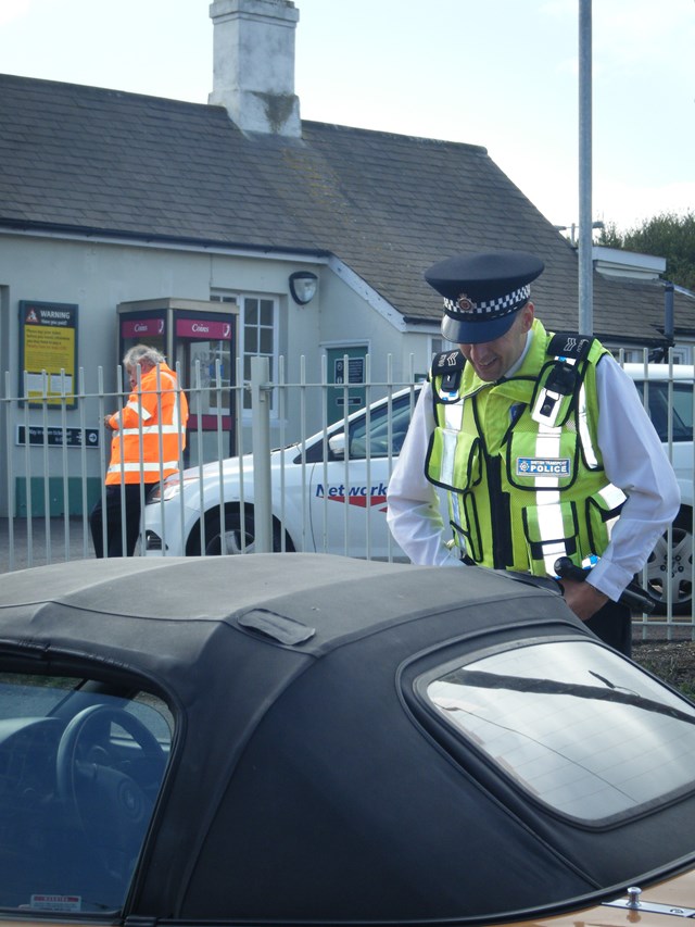 Level Crossing Awareness - Berwick 1: British Transport Police officer discusses the dangers of misusing level crossings with a motorist.