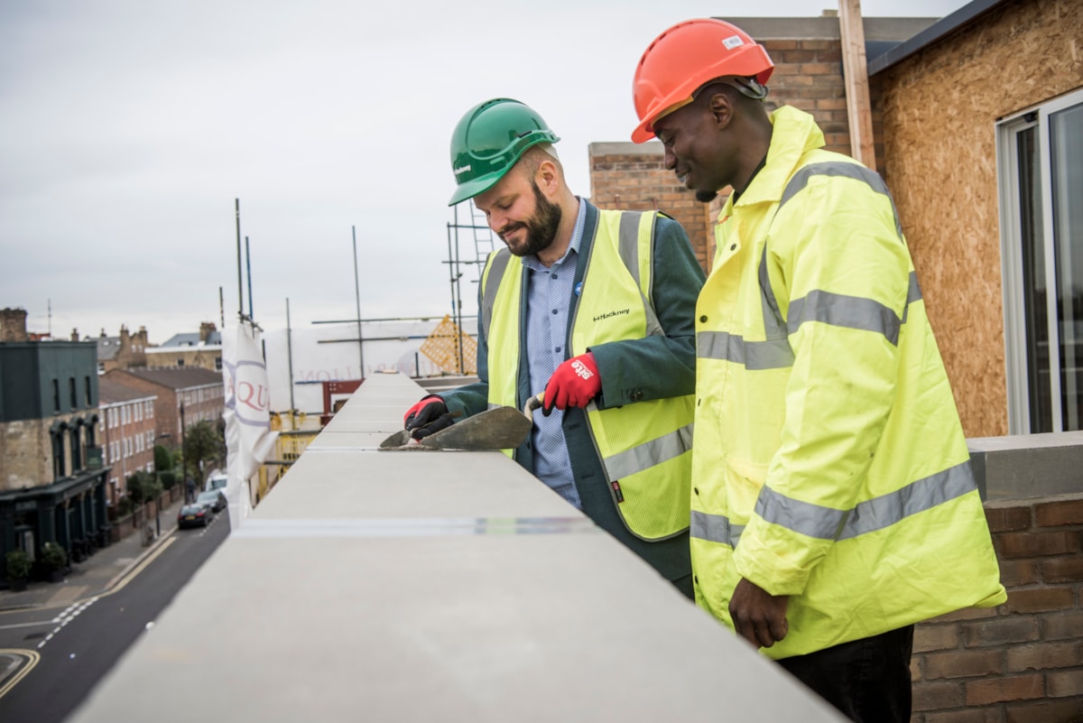 Mayor of Hackney Philip Glanville with Trainee Assistant Site Manager at Quadrillion Construction Thaddeus Buffong