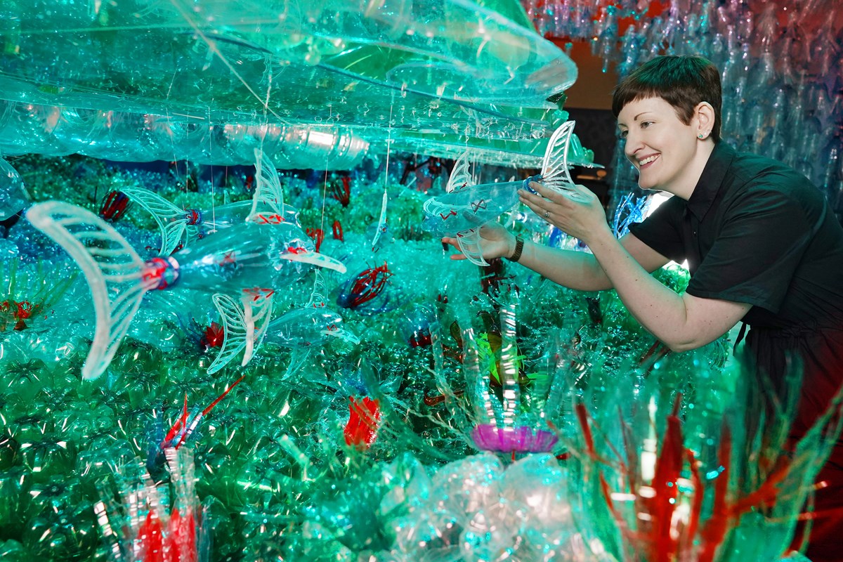 Curator Dr Ali Clark with the Bottled Ocean 2123 installation by George Nuku, part of a new exhibition, Rising Tide: Art and Environment in Oceania which opens Saturday 12 August at the National Museum of Scotland (credit Stewart Attwood)