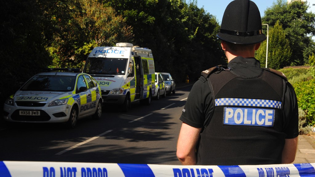 Officer next to crime scene