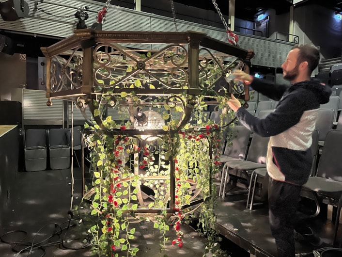 Panto chandelier: Carriageworks technicians have been busy breathing new life into the elegant light fitting, polishing up its elaborate ornamental brass ahead and using all the tricks of the trade to ensure it looks its brilliant best.

Although its age means it can no longer be powered by electricity, by carefully affixing a disco ball to the centre of the chandelier, stage lights can be reflected through its bulbs and around the theatre’s auditorium.

Vines and roses have also been draped from the chandelier, in keeping with the décor of The Beast’s castle