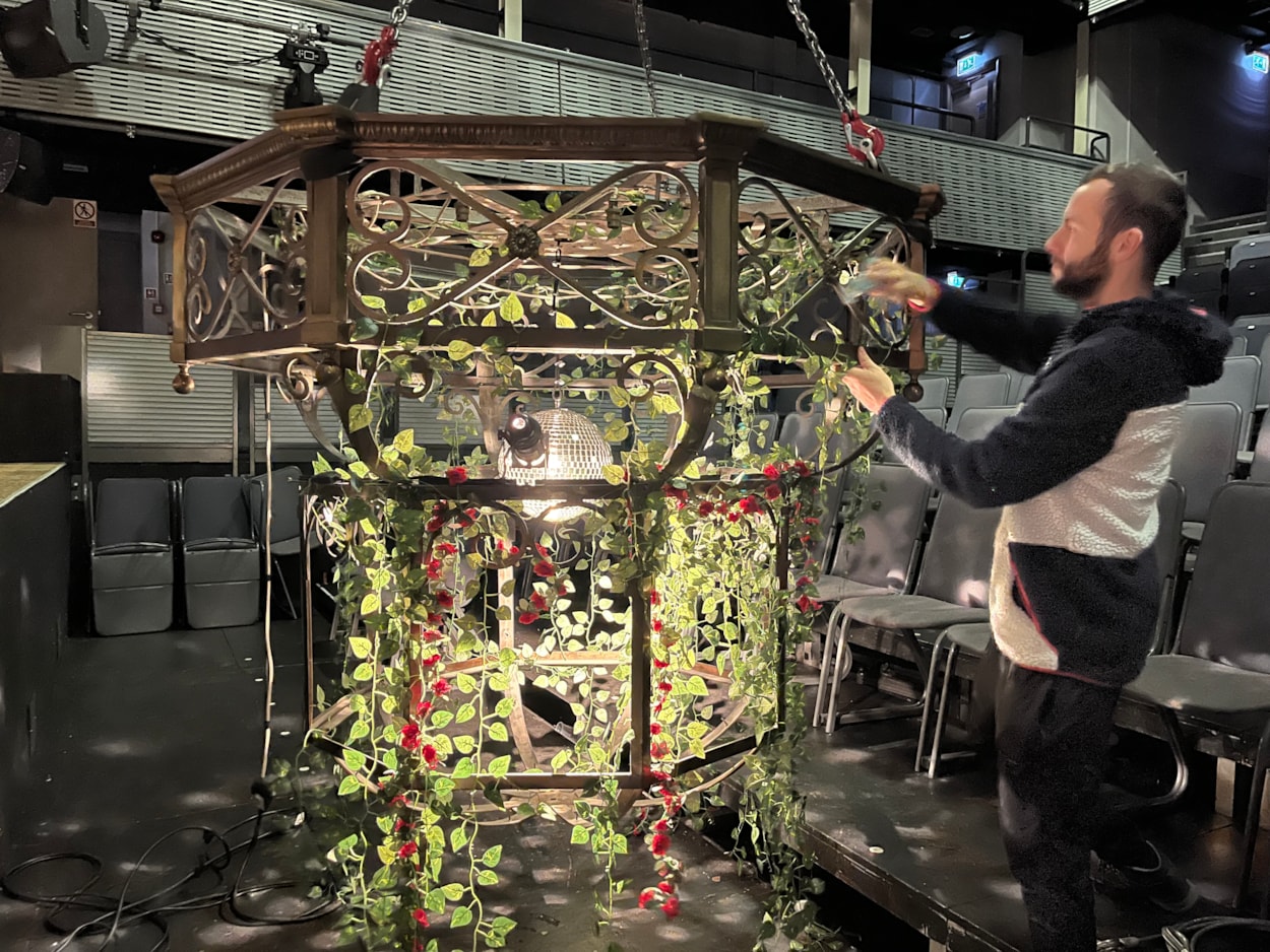 Panto chandelier: Carriageworks technicians have been busy breathing new life into the elegant light fitting, polishing up its elaborate ornamental brass ahead and using all the tricks of the trade to ensure it looks its brilliant best.

Although its age means it can no longer be powered by electricity, by carefully affixing a disco ball to the centre of the chandelier, stage lights can be reflected through its bulbs and around the theatre’s auditorium.

Vines and roses have also been draped from the chandelier, in keeping with the décor of The Beast’s castle