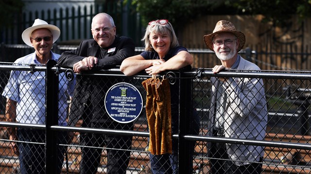 Oxford Preservation Trust celebrates winning National Railway Heritage Award for its work restoring Rewley Road swing bridge: Network Rail's chair, Lord Hendy (second from left) at the unveiling of the OPT plaque