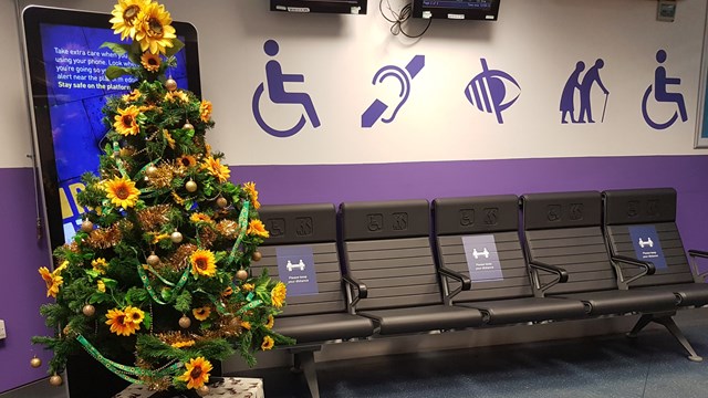 ‘Sunflower’ Christmas tree highlights help for passengers with non-visible disabilities: Euston station's 'sunflower' Christmas tree