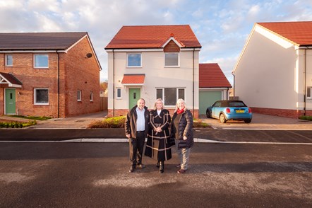 Representatives of Countryside Partnerships, Magna Housing and Somerset Council in front of new homes at Orchard Brooks in Williton.