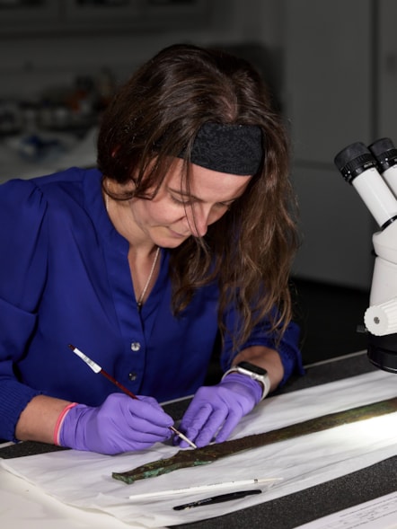 Conservator Bethan Bryan works on the Bronze Age Carnoustie Hoard. Photo © National Museums Scotland (2)