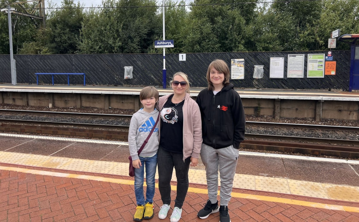 Image shows Keiran Glover (right) with his family