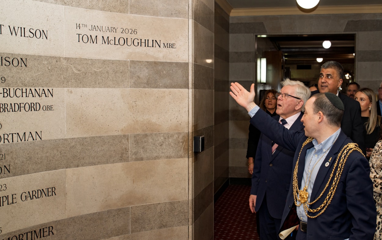 Tom McLoughlin-2: The Lord Mayor of Leeds, Councillor Dan Cohen, shows Tom McLoughlin his name inscribed on the Leeds Award winners' wall.