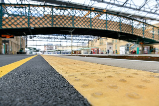 New platform surface at Carlisle with footbridge in the background