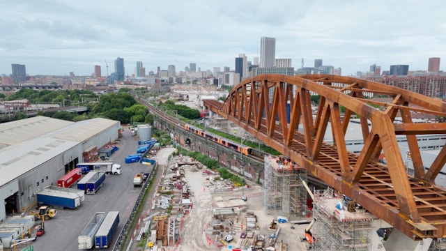 Passengers thanked after major HS2 viaduct installation over Cross City line: Curzon-2-viaduct-over-railway-with-train