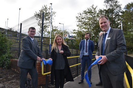 Sara Britcliffe MP cuts a ceremonial ribbon at the opening of a new ramp at Accrington station