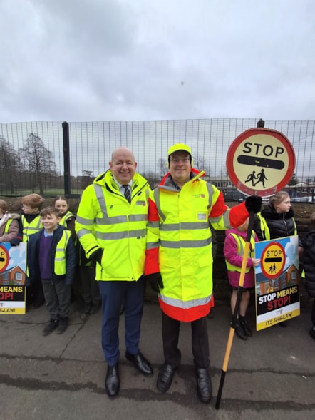 Lancashire County Council's Executive Director, Phil Green School Crossing Patrol Officer Adam on the day of action in Burnley
