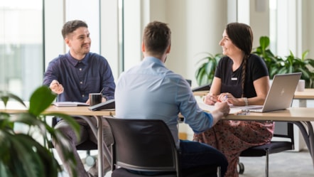 Happy colleagues in meeting