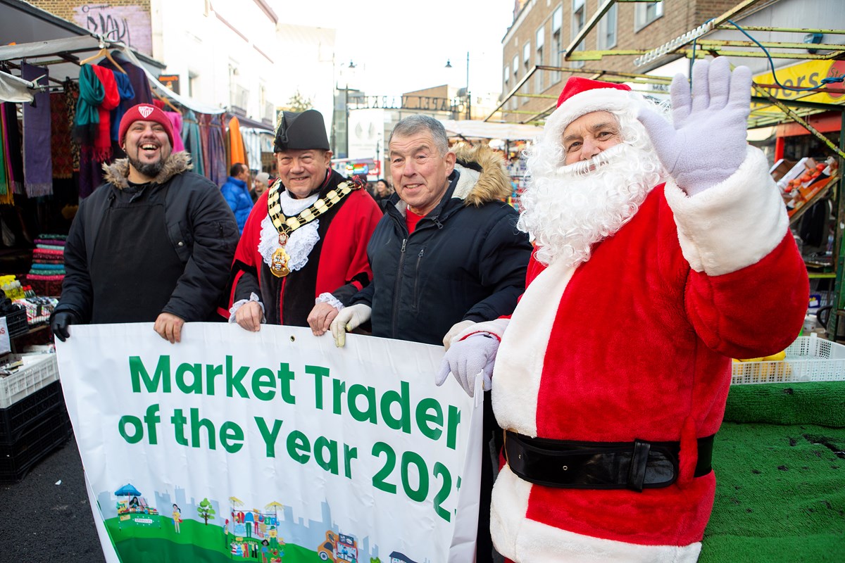 From L-R: Adrian Serrano (Street Food Trader of the Year) Mayor Gary Heather, John Papworth (Market Trader of the Year) and Santa Claus
