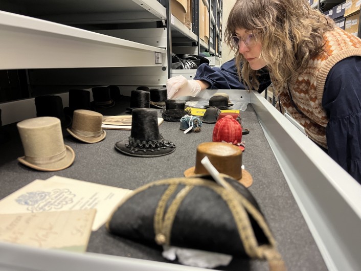 Leeds Discovery Centre hats: Leeds Museums and Galleries' audience development officer Sara Merritt with the remarkable range of tiny replica hats, some of which fit in the palm of a hand. They were ere made by Leeds hatter John Craig in the early 1900s and is being carefully conserved as part of a project at the Leeds Discovery Centre.