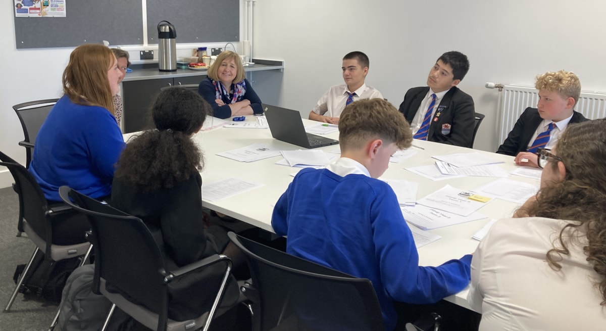 Cabinet Secretary Lynne Neagle with pupils and staff at Whitmore High School, Barry