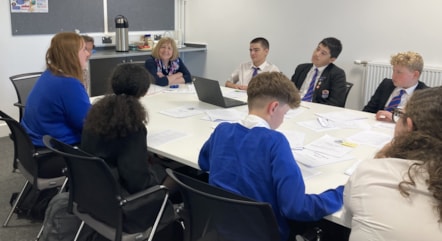 Cabinet Secretary Lynne Neagle with pupils and staff at Whitmore High School, Barry