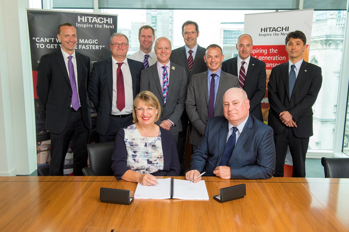 Hitachi Traffic Management signing: Hitachi Rail Europe MD Karen Boswell and Network Rail's Gary Porter celebrate signing the deal to provide Traffic Management to the Thameslink Programme. Also in the picture are the Network Rail and Hitachi teams who will make this all happen