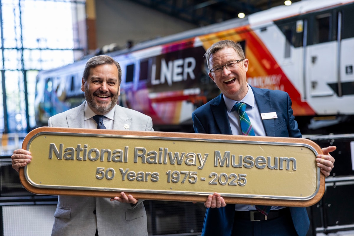 Andrew McLean, NRM, and David Horne, Managing Director of LNER hold a new nameplate