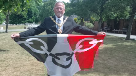 Cllr Pete Lee, the Mayor of Dudley, with the Black Country flag