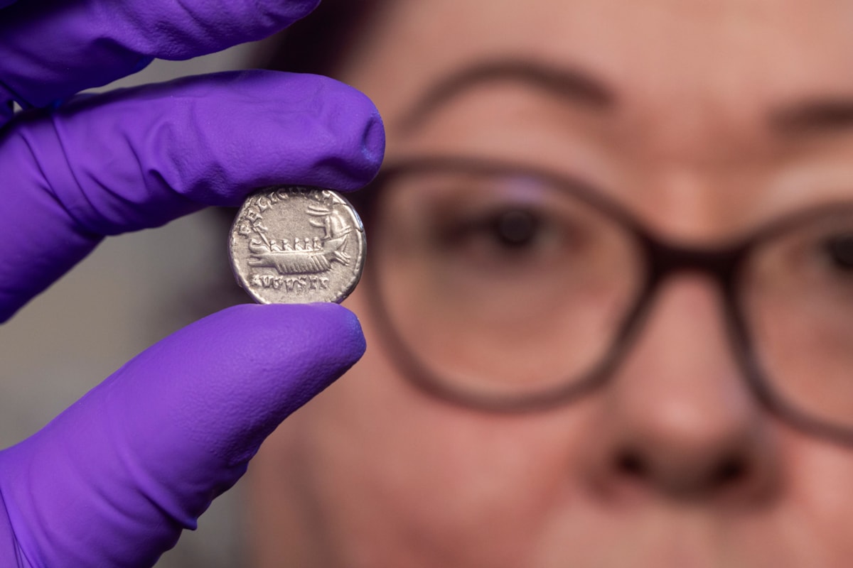Conservator Carolyn Keene examines a Roman silver denarius. Image © Duncan McGlynn (1)