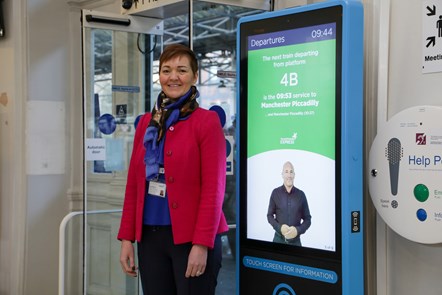 Fran Barrett, Business Assurance Director at TPE, with the new BSL message boards at Huddersfield Station