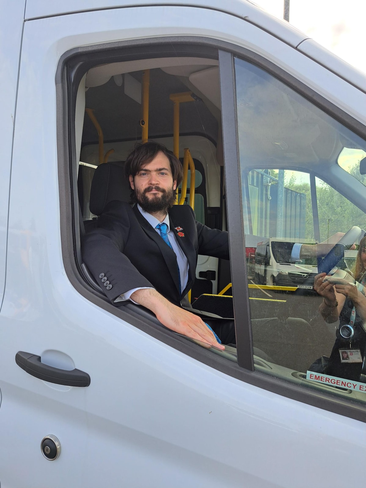 CC Matthew Salter, cabinet member for Education and Skills, sits in the driving seat of one of LCC's new SEND minibuses.