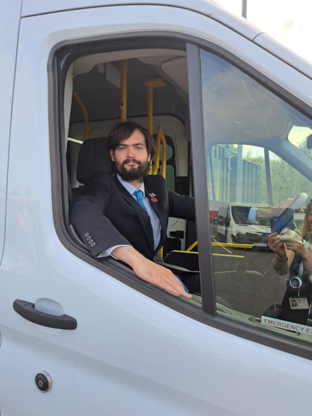 CC Matthew Salter, cabinet member for Education and Skills, sits in the driving seat of one of LCC's new SEND minibuses.