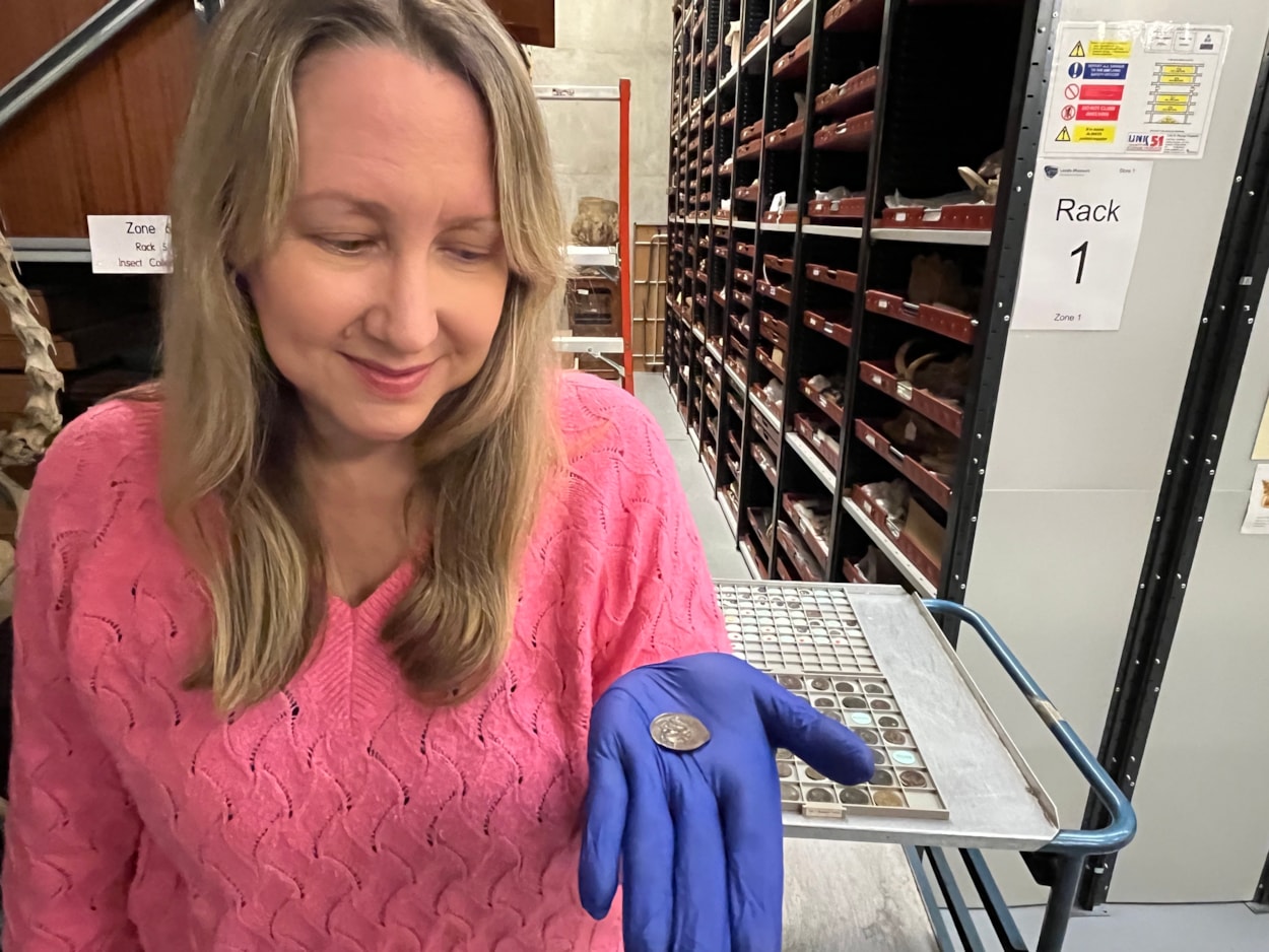 Ancient coin: Kat Baxter, Leeds Museums and Galleries' curator of archaeology and numismatics with the ancient coin now at Leeds Discovery Centre.
The astonishing discovery, handed to an unwitting local bus driver in the 1950s, was produced by Carthaginians, part of the Phoenician culture, in the Spanish city of Cadiz during the 1st Century BC and has now kindly been donated to Leeds Museums and Galleries.