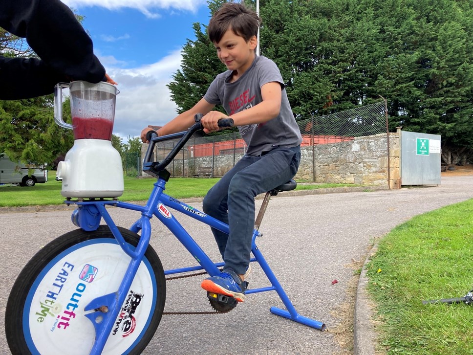 Taidhg peddles a smoothie bike at the Elgin Bike Fest, organised by Moray Council in conjunction with Cycling UK. Smoothie bikes are stationary bicycles that harness pedalling energy to mechanically power a blender.