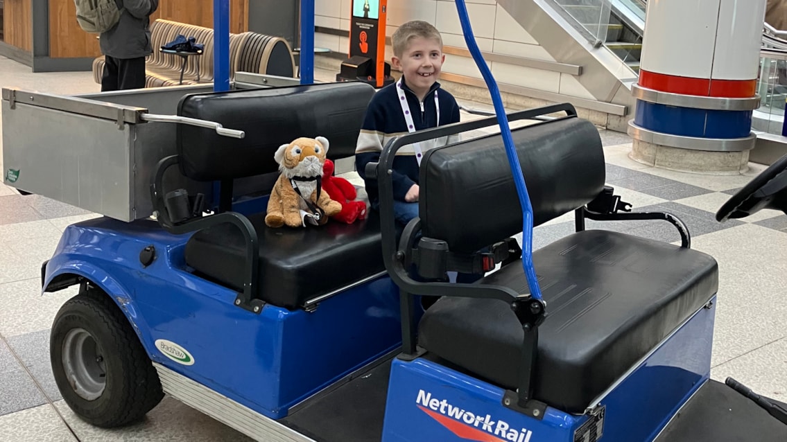 Suffolk boy’s dreams come true with a behind-the-scenes tour of Britain’s busiest railway station and signal box: Austin and Stripey getting a ride in an assistance buggy at Liverpool Street