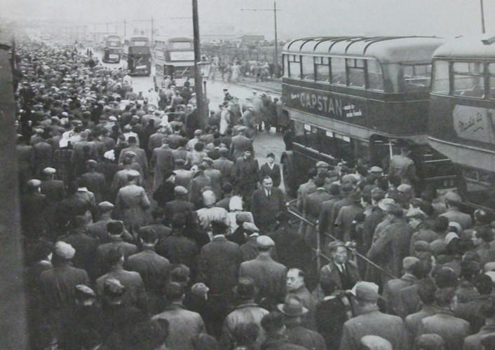 Leeds United Supporters Early 1950s.  Image: © Leeds United Football Club: Leeds United fans on their way home after a match at Elland Road. This photograph isn’t dated, but looking at similar photographs of the area, it was probably taken in the early 1950s. Image: © Leeds United Football Club