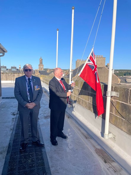 The council’s Royal Navy veteran – Cllr John Divers (right) raises the flag this morning (1 September) ahead of Merchant Navy Day on Sunday 3 September as the council's Armed Forces and Veterans' Champion – Cllr Peter Bloomfield looks on.