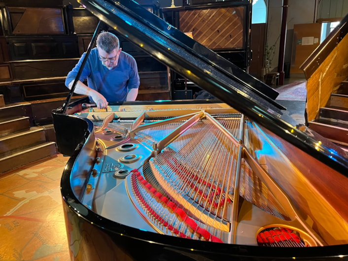 Pianodrome at Leeds City Museum: Expert piano tuner John Tordoff at Leeds City Museum, ensuring the Pianodrome is on song ahead of the concert this Sunday.
The museum and Pianodrome itself will host Duo Ardašev - a piano duo comprising pianists Renata Lichnovská and Igor Ardašev.