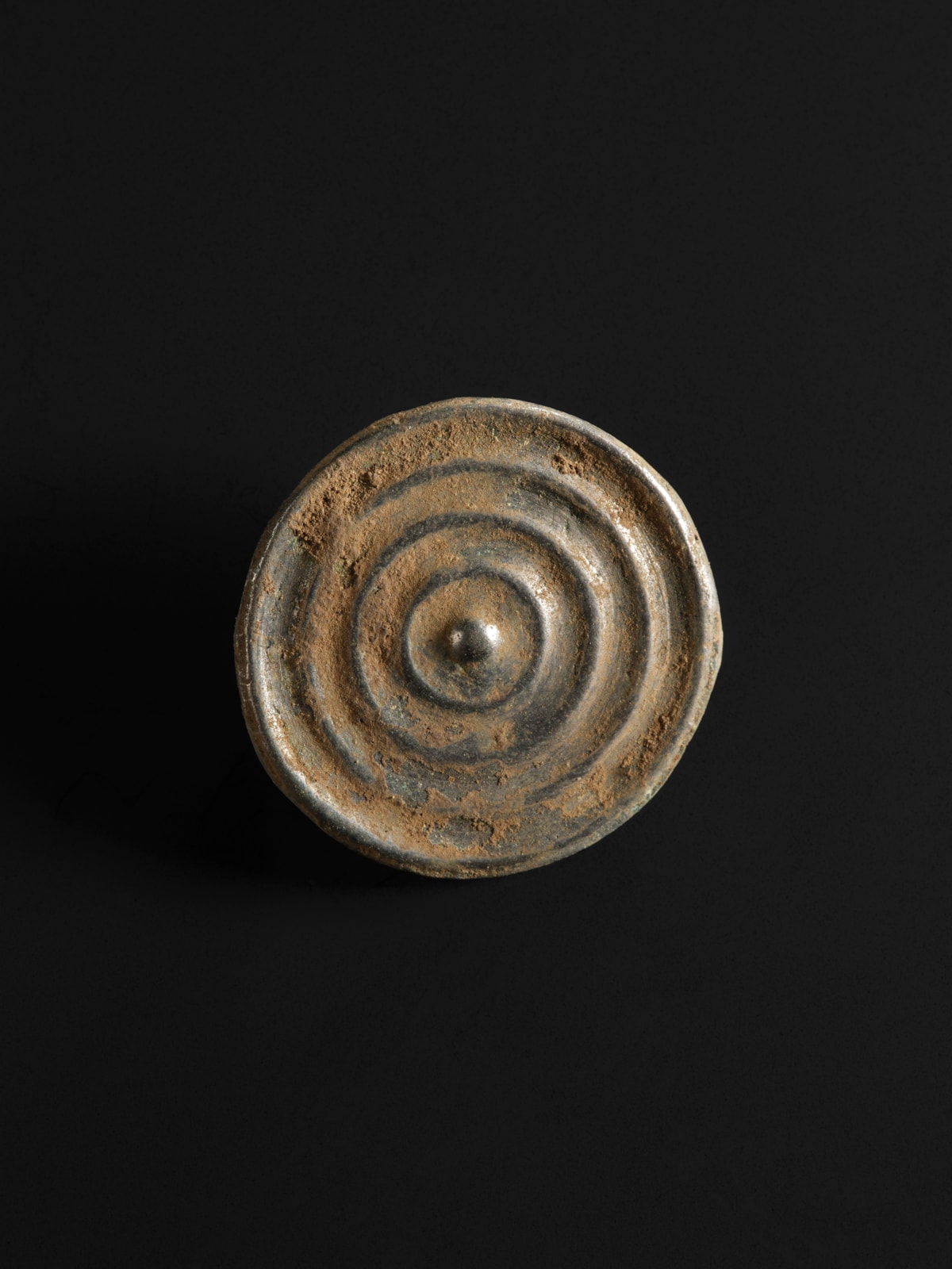 10. A bronze button from the Bronze Age Peebles Hoard. Image © National Museums Scotland