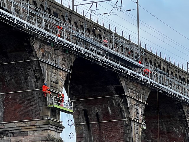 Engineers repairing the Royal Border Bridge using a rope access system - taken 22 November 2022