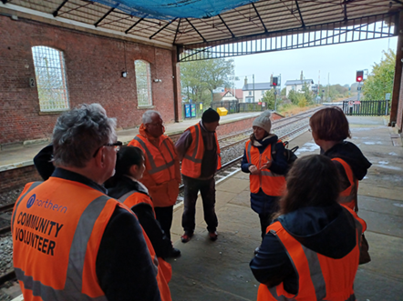 This image shows volunteers at Filey station