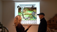 Marta Sienkiewicz presenting her stained glass artwork to a visitor to Strathnaver Museum (c) Eilidh Ross: Marta Sienkiewicz presenting her stained glass artwork to a visitor to Strathnaver Museum (c) Eilidh Ross