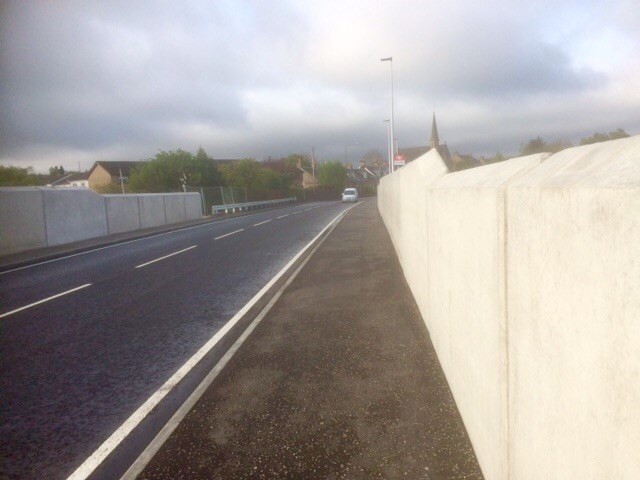 Traffic using reconstructed A71 bridge over railway at West Calder station