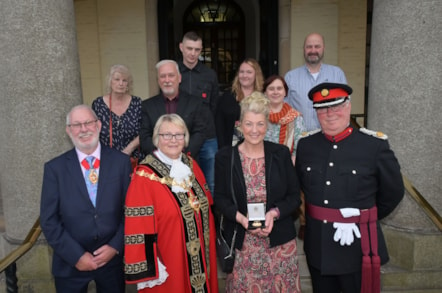 Rachel Body, wife of Alderman Richard Body accepts his posthumous award alongside his family, with the Mayor of Dudley, consort and Deputy Lieutenant